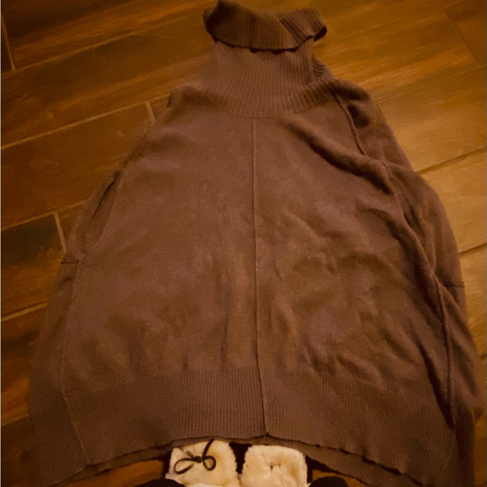 Sleeveless brown turtleneck sweater